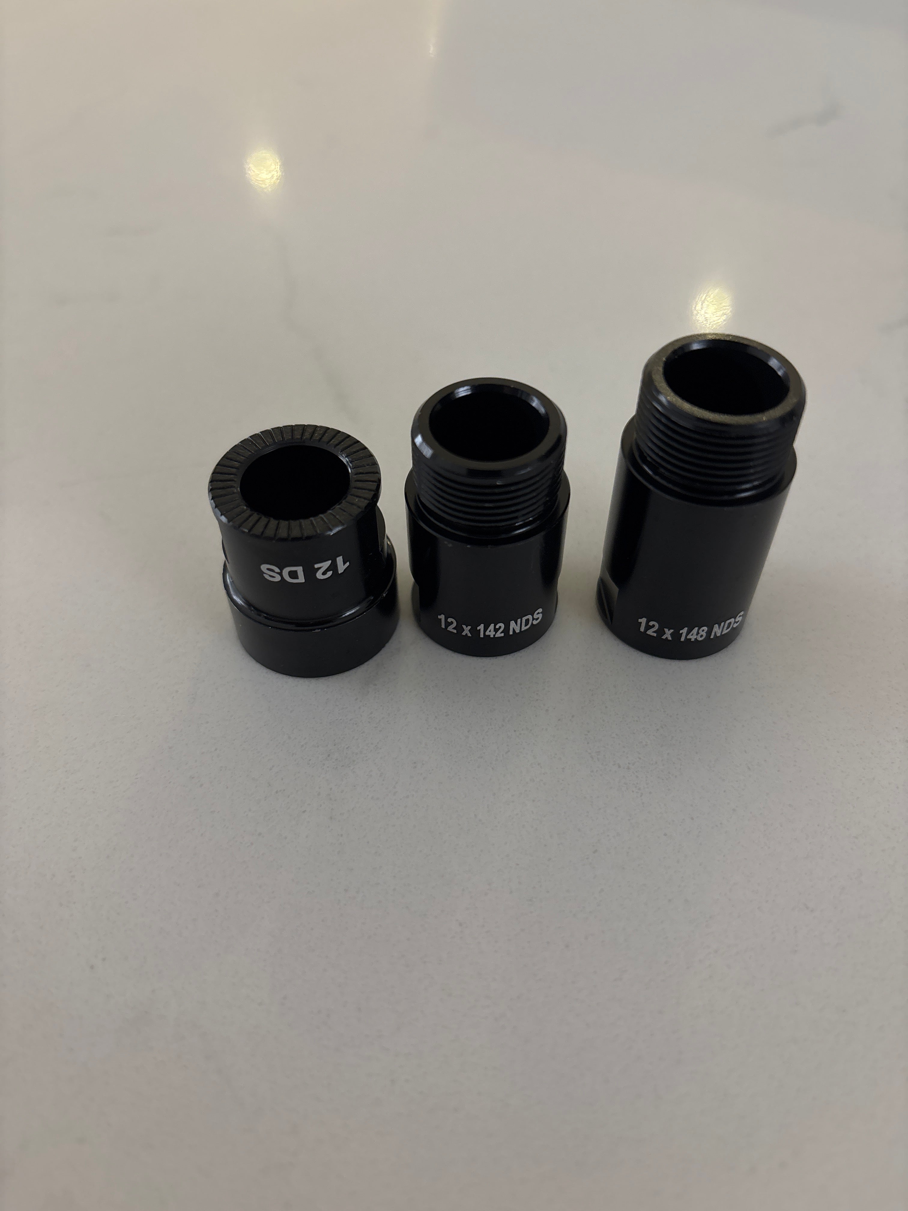 Tacx 142 and 148mm Thru-axle Adapter End Caps – Adventure Kit Hire
